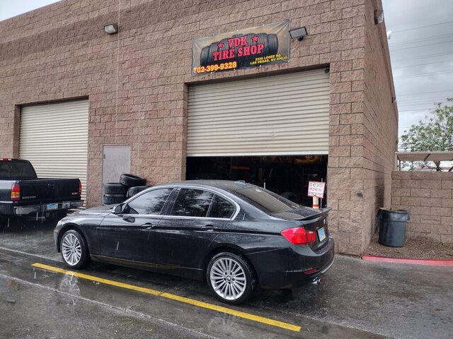 Black Car Parked At Tire Shop 026 — VDK Tire Shop