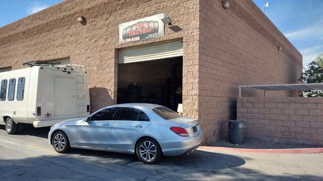 Silver Car Parked Outside Tire Shop 012 — VDK Tire Shop