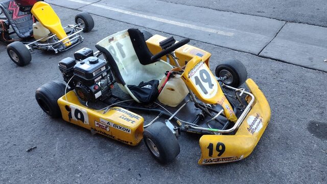 Yellow Go Kart Number 19 004 — VDK Tire Shop