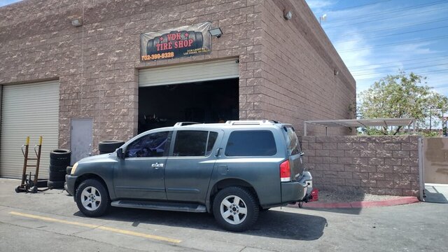 Silver Nissan Armada Outside Tire Shop 006 — VDK Tire Shop