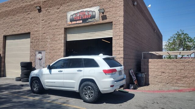White Jeep Parked At Tire Shop 002 — VDK Tire Shop