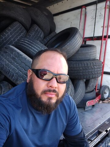 Bearded Man Tire Stack Selfie 019 — VDK Tire Shop