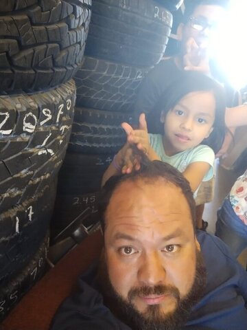 Man Girl Stacked Tires Selfie 021 — VDK Tire Shop