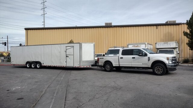 White Pickup Towing Enclosed Trailer 011 — VDK Tire Shop