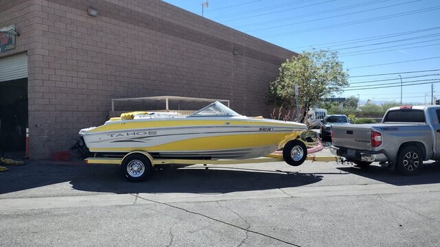 Yellow Tahoe Boat On Trailer 006 — VDK Tire Shop