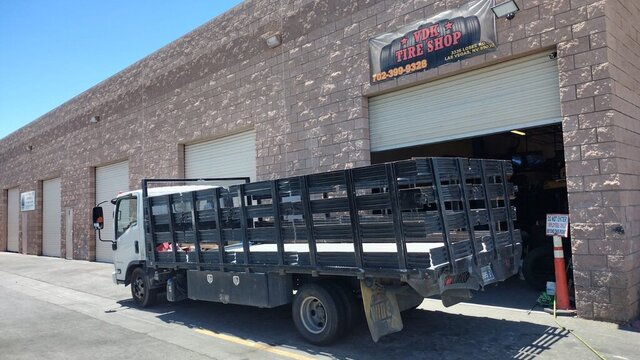 Flatbed Truck Parked At Tire Shop 020 — VDK Tire Shop