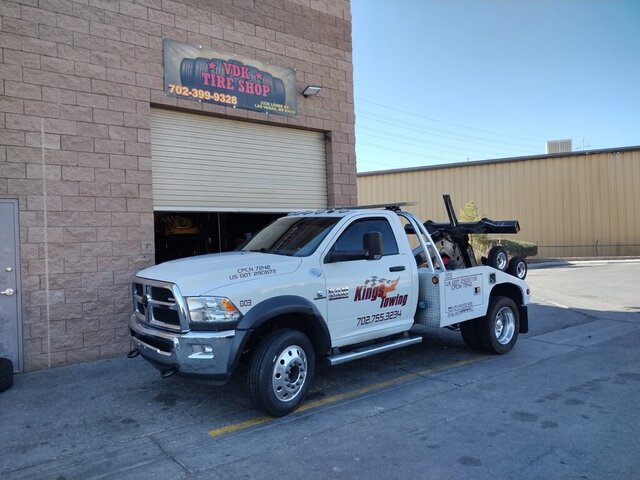 Work truck receiving tire service at VDK Tire Shop