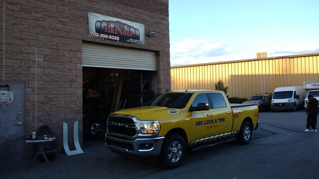 Yellow Tow Truck Parked Tire Shop 028 — VDK Tire Shop