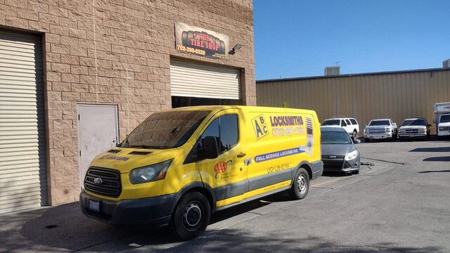 Yellow Locksmith Van Parked 009 — VDK Tire Shop